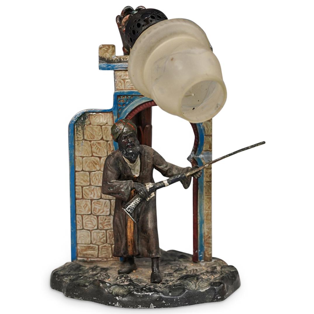 Franz Bergman Vienna Style Orientalist Lamp: DESCRIPTION: A Franz Bergman style bronze orientalist cold painted lamp depicting a middle eastern man carrying a gun. It is marked with an embossed "Made in Austria" mark on the bottom. CIRCA: 20th C