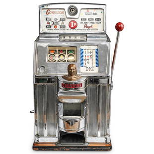 Jennings Governor Tic Tac Toe Slot Machine: DESCRIPTION: A mid century Jennings Governor Tic Tac Toe slot machine with Chief head. It is crafted with a chrome and wood case. CIRCA: Mid. 20th Century. ORIGIN: USA. DIMENSIONS: W: 15" H: 27 1/2" D