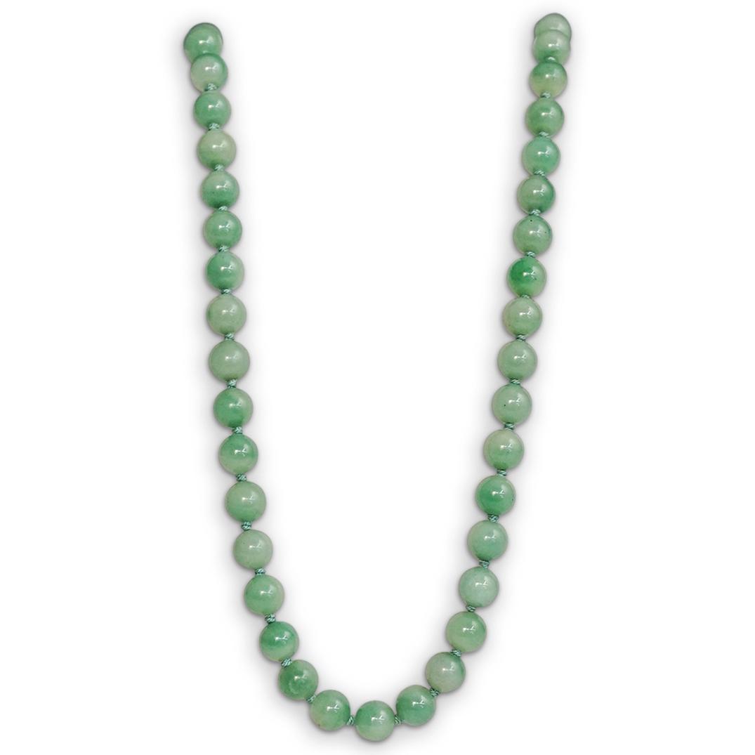 12K and Jade Bead Necklace: DESCRIPTION: A vintage deep green jade beaded necklace with a 12K yellow gold lock and with a disk pendant with a cloisonne pendant bail crafted with a flower shape design. CIRCA: 20th Century. ORIGIN
