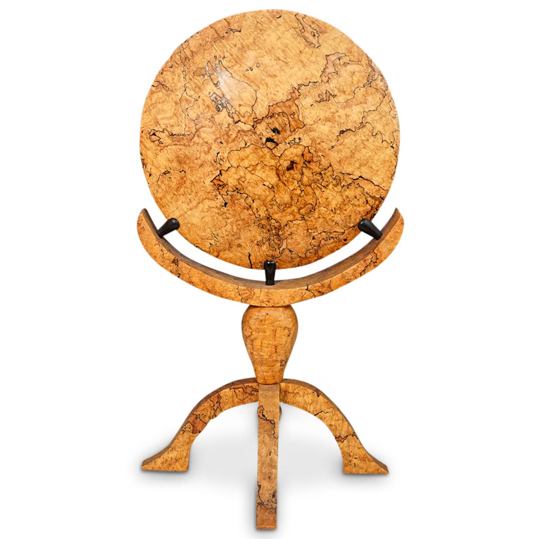 Tom Webster Spalted Maple Wood Sculpture: DESCRIPTION: A Tom Webster spalted maple wood sculpture depicting a circular shape on a four legged stand base. It is signed "Tom Webster" and is marked "Spalted Maple". CIRCA: 20th Century. DIMENSION