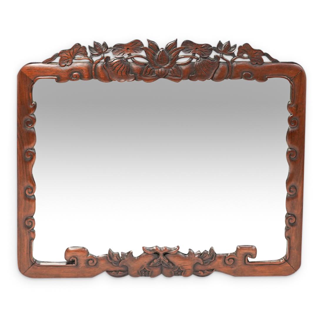 Antique Chinese Carved Wooden Mirror: DESCRIPTION: An antique chinese carved wooden mirror with floral and geometrical patterns decorative designs. CIRCA: 20th Century. ORIGIN: China. DIMENSIONS: W: 17 1/2" H: 15". Have a similar item to 