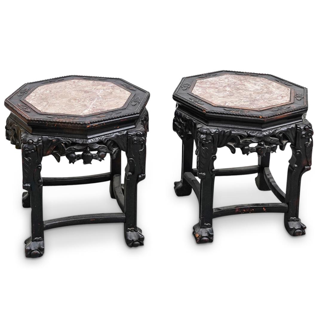 Pair of Chinese Carved Pedestals: DESCRIPTION: (2 Pc) A pair of Chinese carved wood pedestals featuring floral motifs and marble inlaid centers with octagon shaped top. ORIGIN: China. DIMENSIONS: W: 18" H: 18 1/4". Have a similar item