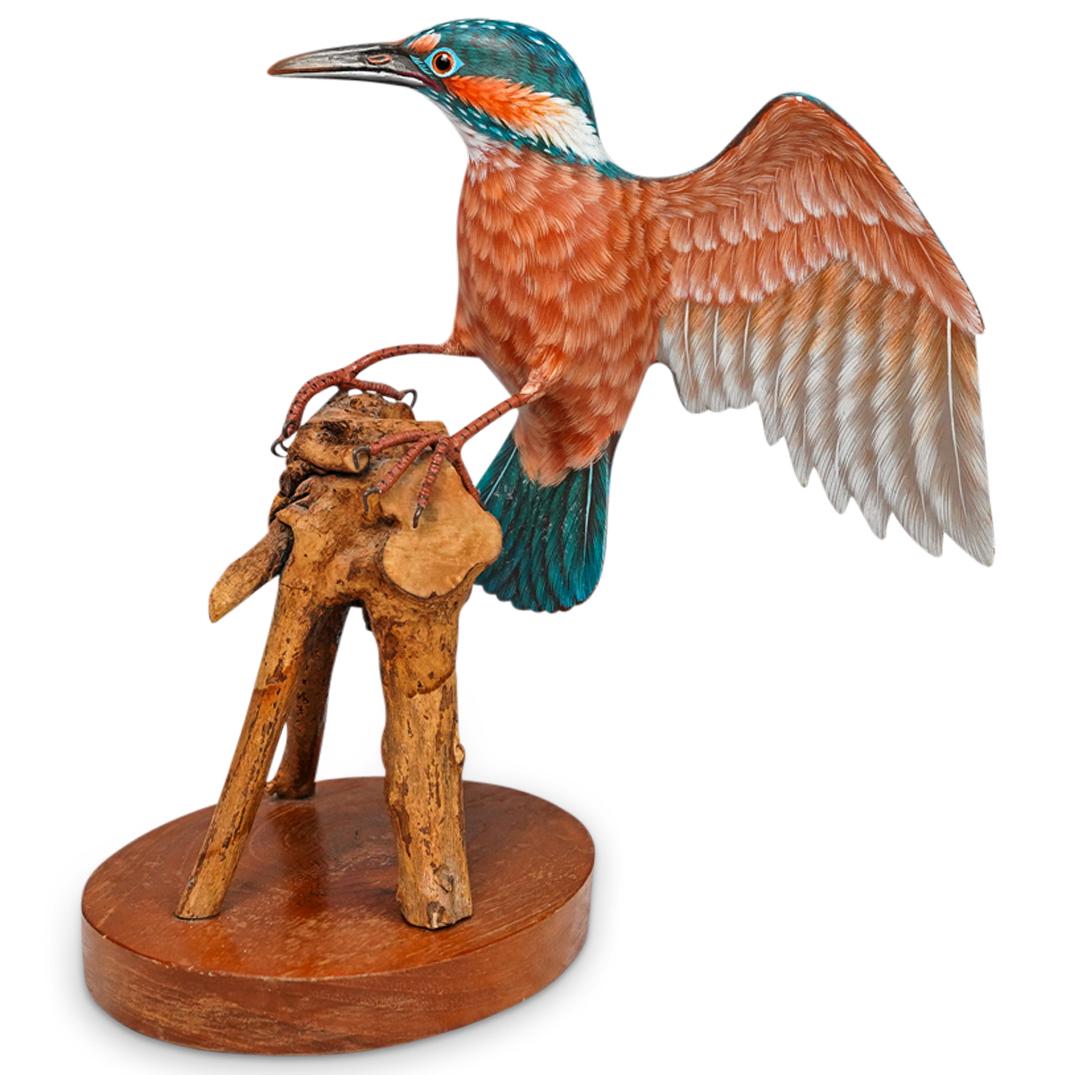 Kingfisher Carved Bird Sculpture: DESCRIPTION: A hand carved wood bird sculpture depicting a kingfisher with naturalistic painted details, mounted to a branch formed base. Base stamped: "Penco, New Bedford, Mass" CIRCA: 20th Cent. ORI