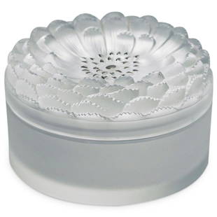 Lalique "Dahlia" Crystal Powder Box: DESCRIPTION: Lalique "Dahlia" powder box, glass box with frosted flower with enamel accents. Incised "Lalique France" CIRCA: Mid 20th Century. ORIGIN: France DIMENSIONS: W: 5.5" H: 3.25" Have a