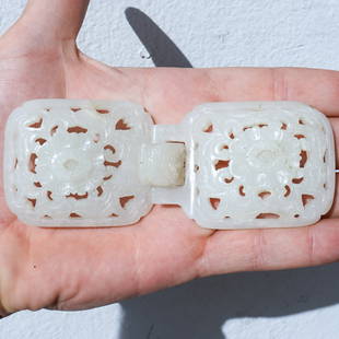 18th Cent. White Jade Two-Part Buckle: DESCRIPTION: 18th Cent. White jade two-part buckle with flower and dragon head designs. CIRCA: 18th Century ORIGIN: China DIMENSIONS: (H: 2" x W: 0.5" x L: 2.75") & (H: 2" x W: 0.25" x L: 2.5") 