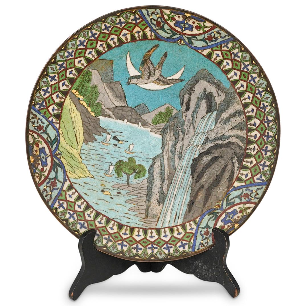 Chinese Antique Cloisonne Plate: DESCRIPTION: A chinese antique cloisonne plate with a mountain and a water cascade central motif and further embellish with a decorative rim. CIRCA: 20th Century. ORIGIN: China. DIMENSIONS: W: 11 3/4"