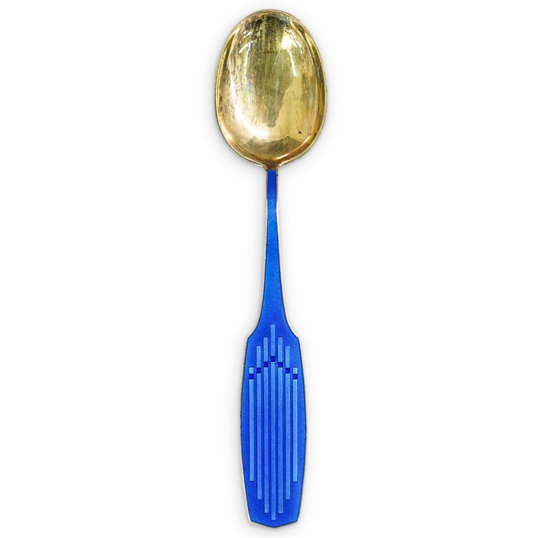 Sterling "A. Michelsen" Danish Spoon: DESCRIPTION: Sterling silver "A. Michelsen" Danish spoon with blue enamel handle. Hallmarked: "A. Michelsen, ALH, H.NILS, Sterling Denmark" CIRCA: 20th Century. ORIGIN: Denmark DIMENSIONS: L: 6.5" x W