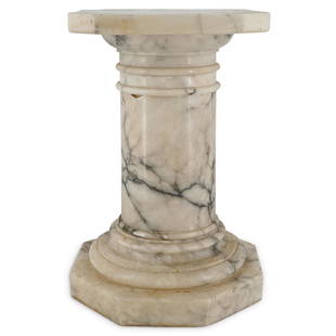 Variegated White Marble Pedestal: DESCRIPTION: A White marble pedestal featuring black veined variegated pattern. CIRCA: Early - Mid 20th Cent. ORIGIN: European DIMENSIONS: H: 21" W: 13" Depth: 13" Have a similar item to sell? Contact