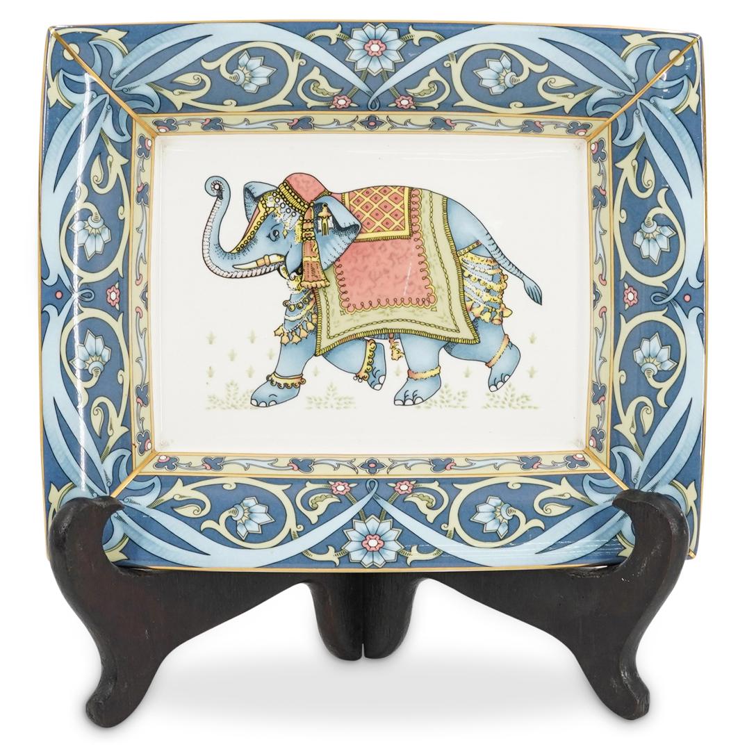 Wedgwood Elephant Ashtray: DESCRIPTION: Wedgwood ashtray with image of eastern elephant framed by ornate floral patterns. Mark on underside says 'WEDGWOOD Bone China MADE IN ENGLAND BLUE ELEPHANT WEDGWOOD 1993". Comes in origin