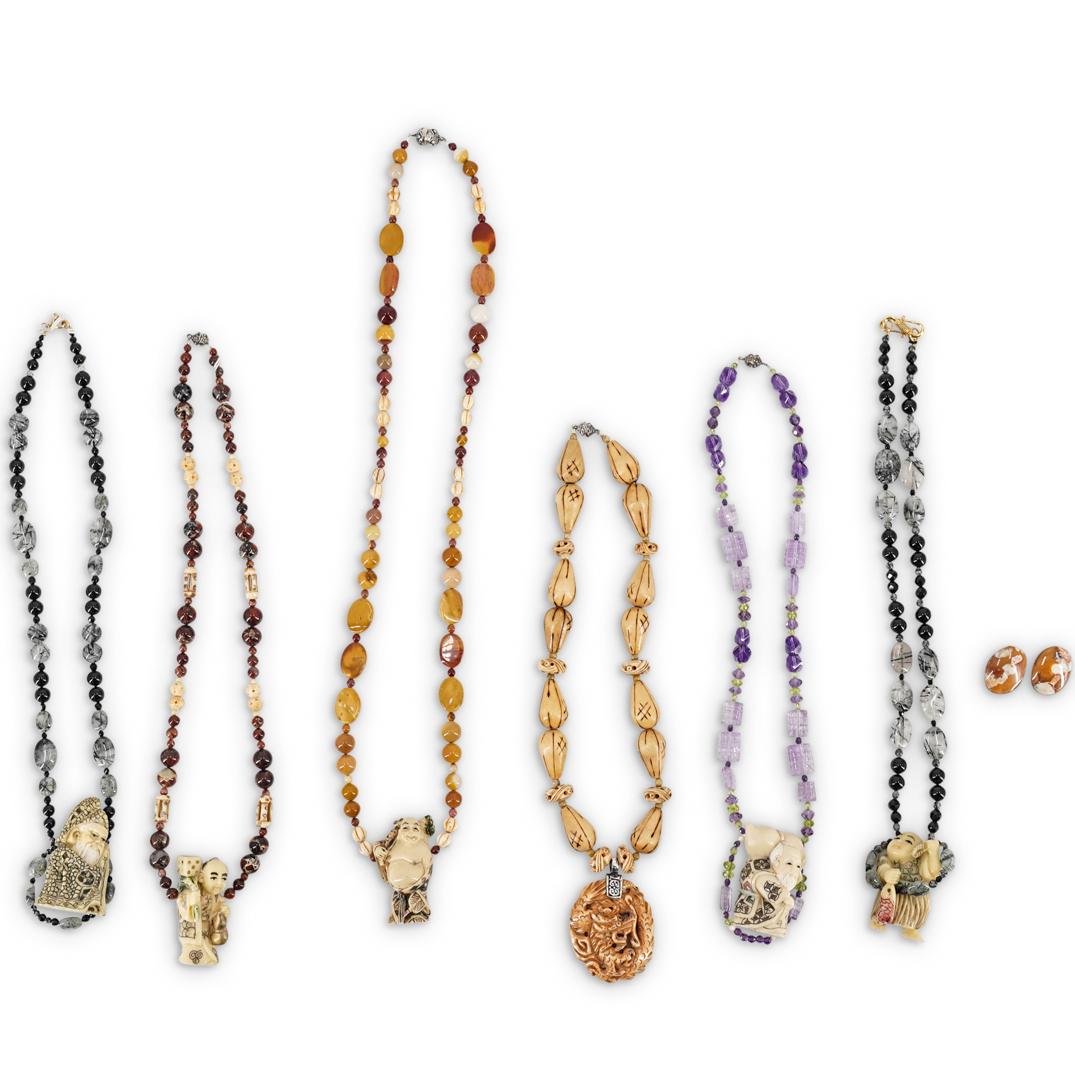 (6 Pc) Paulette Carved Resin and Semi Precious: DESCRIPTION: A Group of six beaded necklaces comprised of carved resin figural Buddhas, decorated with various semi precious stones including, Amethyst, Quartz, Onyx, Jasper, Bone and wood Beads. CIRC