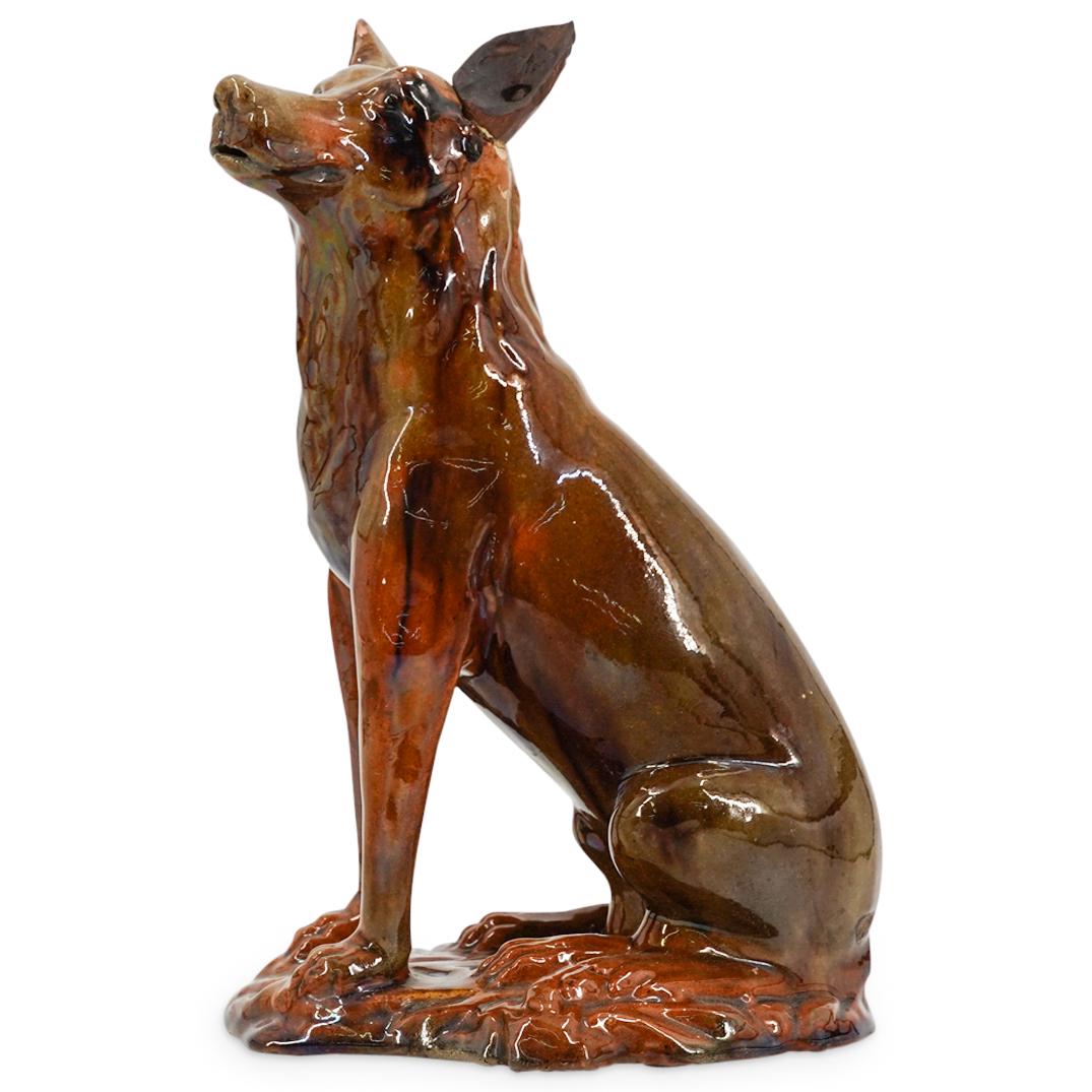 Stamped Antique Redware Dog Decanter: DESCRIPTION: Redware dog decanter with glaze coat and removable wooden left ear. Mouth functions as spout. Stamp imprinted on bottom of piece is present but too worn to determine origin. CIRCA: Early