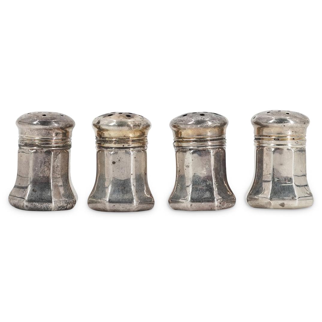 (4 pc) Cartier Sterling Salt Shakers: DESCRIPTION: Cartier sterling silver salt shakers. Each shaker has Cartier logo and "STERLING" engraved on bottom. CIRCA: 20th Century. ORIGIN: France DIMENSIONS: W: 1" H: 1.5". Have a similar item to