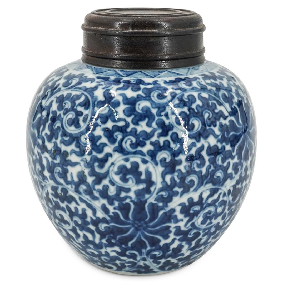 Chinese Blue & White Porcelain Ginger Jar: DESCRIPTION: A chinese blue and white porcelain ginger jar, with a floral with foliage intertwined pattern decoration and with a carved wooden lid. Decorated on the bottom with a blue double lined cir
