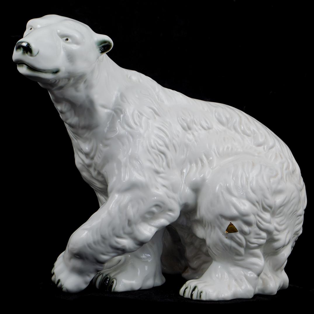 Royal Dux Porcelain Polar Bear: DESCRIPTION: A glazed hand painted porcelain polar bear marked "Royal Dux" with Hallmarking and Royal Dux sticker.CIRCA:20th Ct.ORIGIN:CzechoslovakiaDIMENSIONS: 15x17x10" CONDITION: Great condition. S