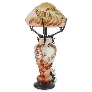 Emile Galle Glass Lamp With Bronze Shade Holder: DESCRIPTION: Emile GallÃ© glass lamp etched with painted foliage motifs and signed "GallÃ©" toward the base. Shade is glass etched with different foliage motifs, signed "GallÃ©", and supported