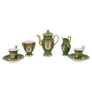 (7 pc) Sevres Hand-Painted Porcelain Demitasse Set: DESCRIPTION: Sevres hand-painted porcelain demitasse set. Each piece is decorated with an eagle crest in front of a banner with scepters and a crown; this image is against a green background