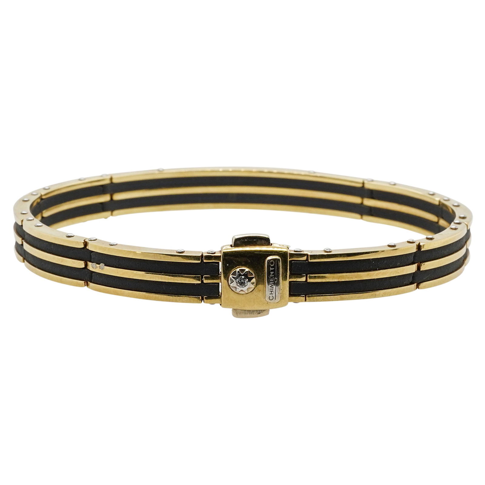 Vintage Chimento 18k Gold Bracelet: DESCRIPTION: A VIntage Chimento Bracelet comprised of 18k yellow gold segments with rubber spacers. The outer bracelet accented with white gold nailheads, completed with a single Diamond placed along