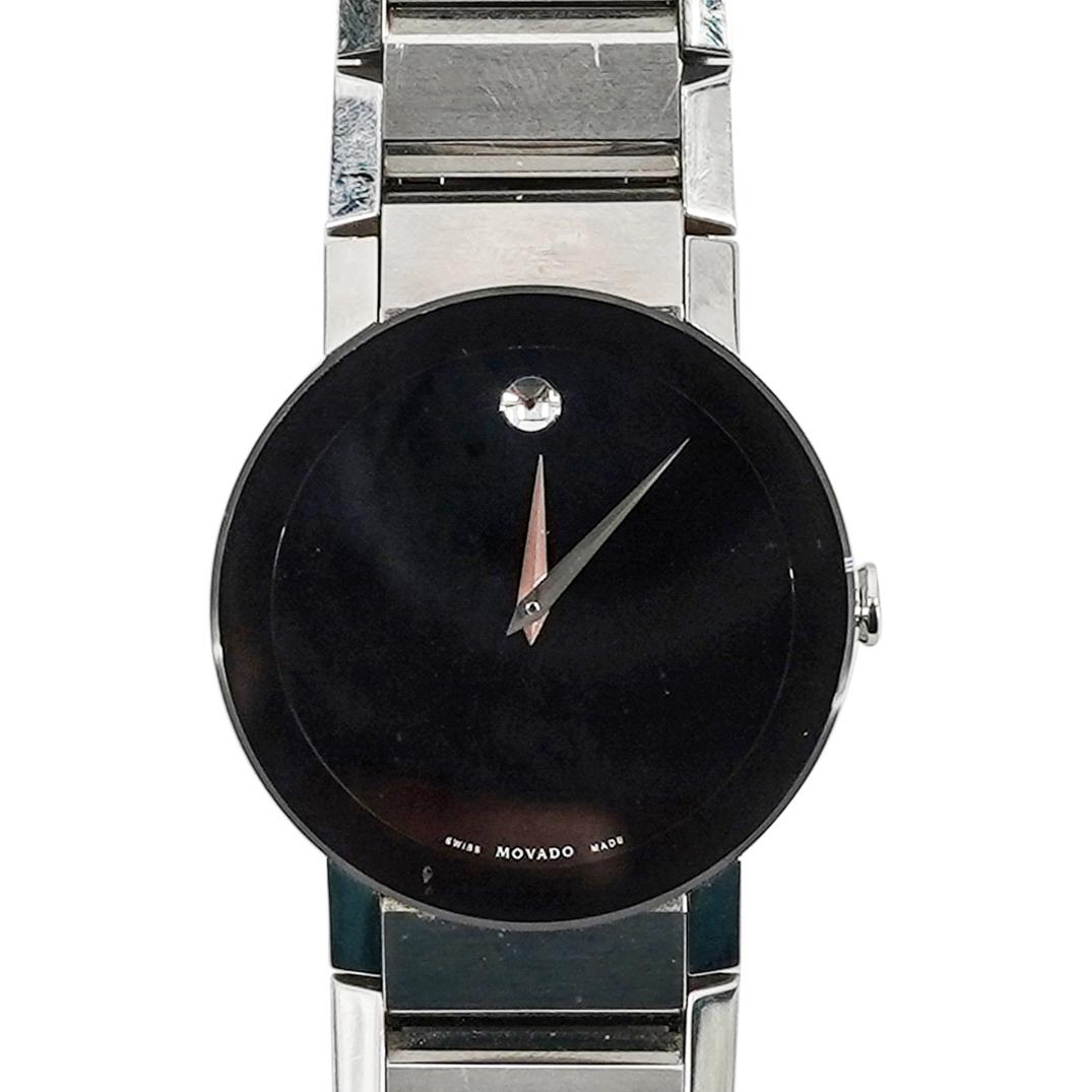 Movado Modern Classic Stainless Steel Watch: DESCRIPTION: Stainless Steel 36mm Round Case. Stainless Steel Bracelet With Deployant Clasp. Fixed Stainless Steel Bezel. Black Dial. Hours, Minutes. Sapphire Crystal. Solid Caseback. Swiss Quartz Mov