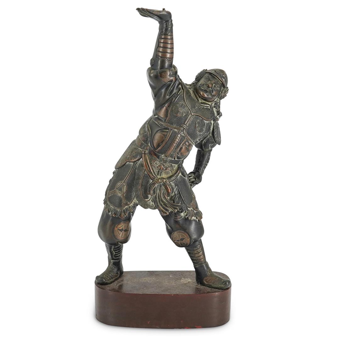 Parcel Gilt Bronze Vaisravana Figure: DESCRIPTION: Parcel bronze gilt figure of Vaisravana/Bishamonten. Figure wears heavy armor decorated with wheels surrounded by clouds and pants decorated with medallions with a geometric design. He ha