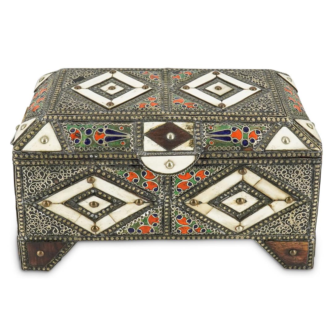 Moroccan Trinket Jewelry Box: DESCRIPTION: A Moroccan handmade trinket jewelry box. Encased in decorative filigree metal and with inlaid wood & bone decorative accents. The interior is fully lined in a burgundy velveteen material.
