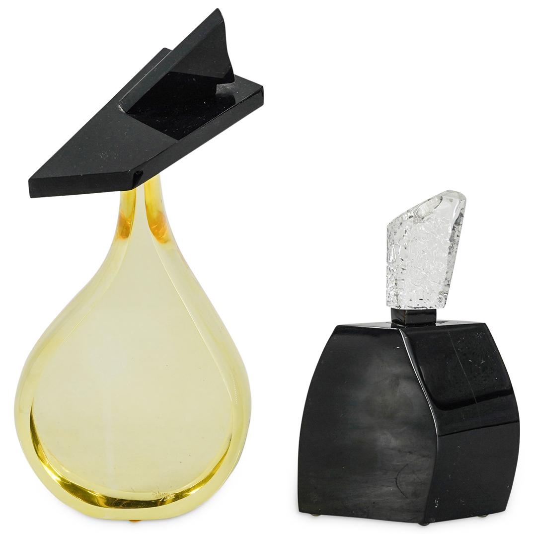 (2 Pc) Hivo Van Teal Lucite Perfume Bottle Sculptures: DESCRIPTION: (2 Pc) A Pair of mid-century modern acrylic yellow & black lucite geometric sculptures by Hivo Van Teal (Cuban-American, 20th Century). These two sculptures depict each a large scale perf