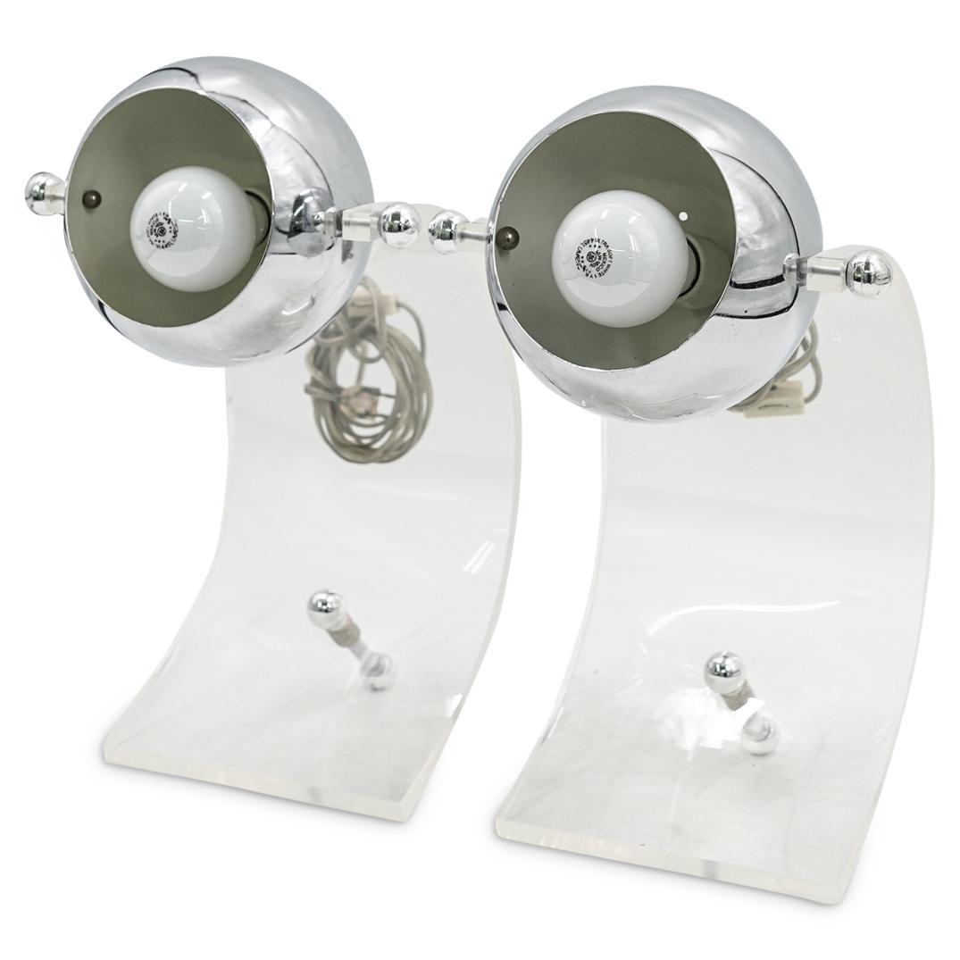(2 Pc) Mid Century Sonneman Lucite & Chrome Table Lamps: DESCRIPTION: (2 Pc) A Pair of mid century modern Robert Sonneman for George Kovacs eyeball orb curved lucite and chrome bulb table desk lamp. Designed by Robert Sonneman, circa the 1970s. CIRCA: 20th