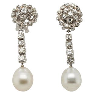 Pair of Platinum Diamond and Pearl Drop Earrings: DESCRIPTION: A Pair of Drop earring composed of a Platinum foundation inserted with approx 1 ct of Diamonds total, with a delicate dangle sustaining a beaded pearl. Total Weight: 9.7 dwt CIRCA: Mid-La