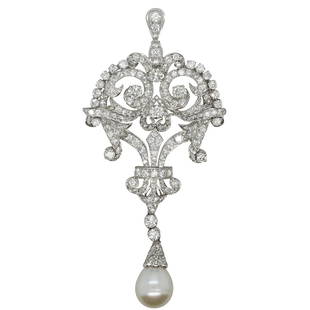 Art Deco Platinum, Diamond and Pearl Brooch: DESCRIPTION: A VIntage Platinum brooch/pendant features open pierce work garnished with approx. 3.5 cts in diamonds and a single suspended pearl along the bottom. Has bale and pin closures. Total