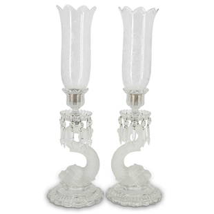 (2 Pc) Baccarat Crystal Dolphin Candle Holders: DESCRIPTION: Pair of Baccarat crystal dolphin candle holders, each featuring a frosted figural dolphin stem, a bobeche adorned with hanging prisms, and and a mounted candle socket with etched crystal