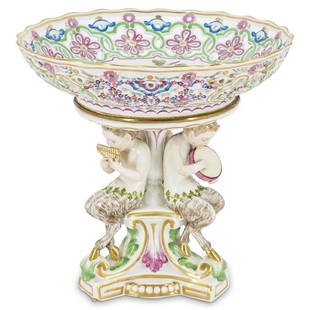 Meissen Porcelain Centerpiece Footed Fruit Bowl: DESCRIPTION: A Meissen centerpiece footed fruit bowl, supported by three sculptured satyr figurines, playing musical instruments. The circular bowl features a pierced reticulated body with floral