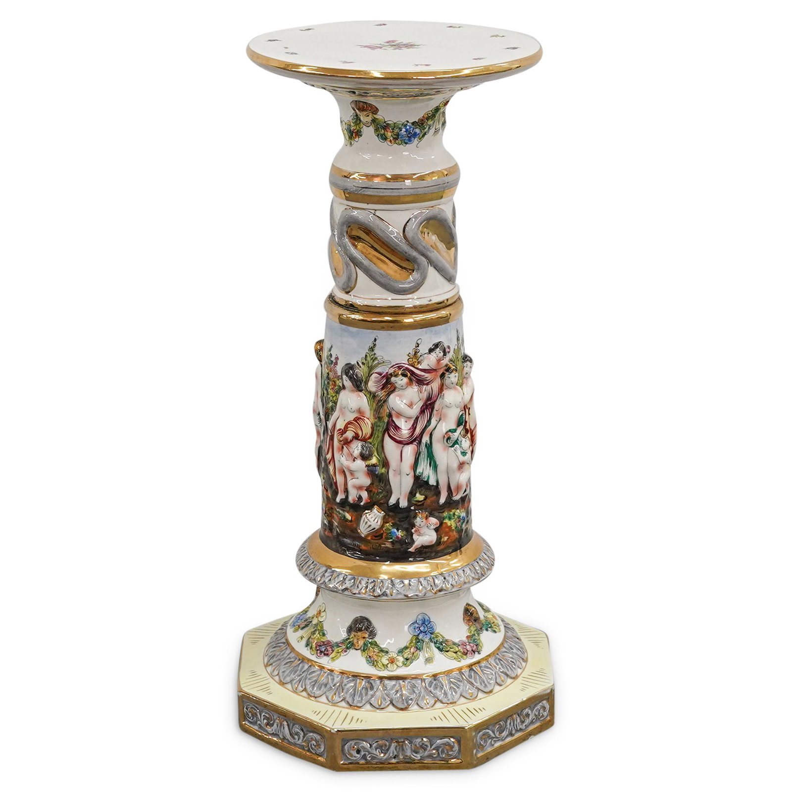 Capodimonte Neoclassical-Style Porcelain Pedestal: DESCRIPTION: Capodimonte porcelain pedestal featuring neoclassical-style imagery on the side of nude women and putti in a clearing. Sides are further embellished with floral and foliage motifs and des
