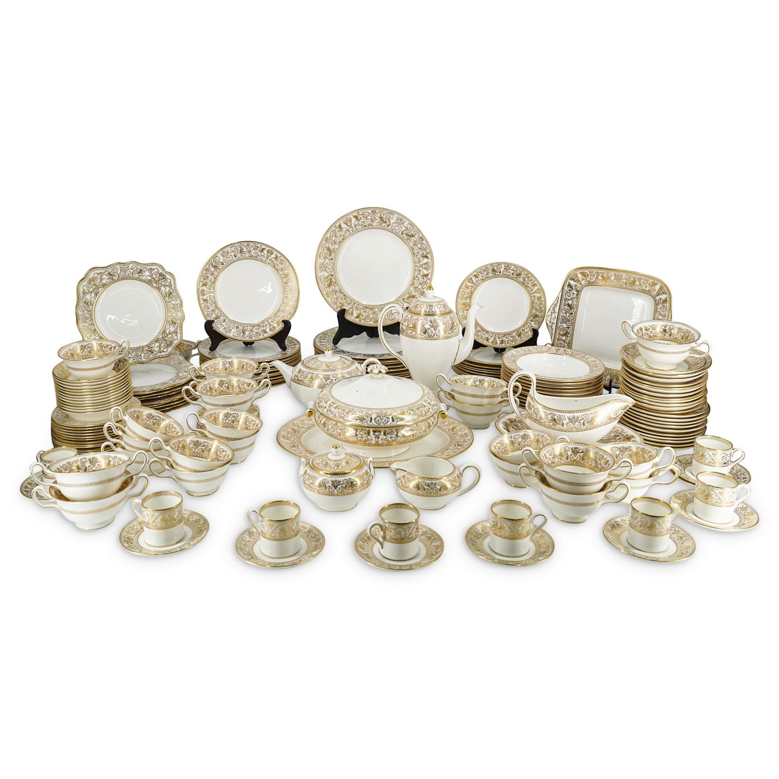 (158 Pc) Wedgwood Porcelain "Gold Florentine": DESCRIPTION: (158 Pc) A Wedgwood porcelain dinnerware set in the "Gold Florentine" pattern depicting a decorated rim with gold dragons on a white background. Marked "Wedgwood" and "Bone China England