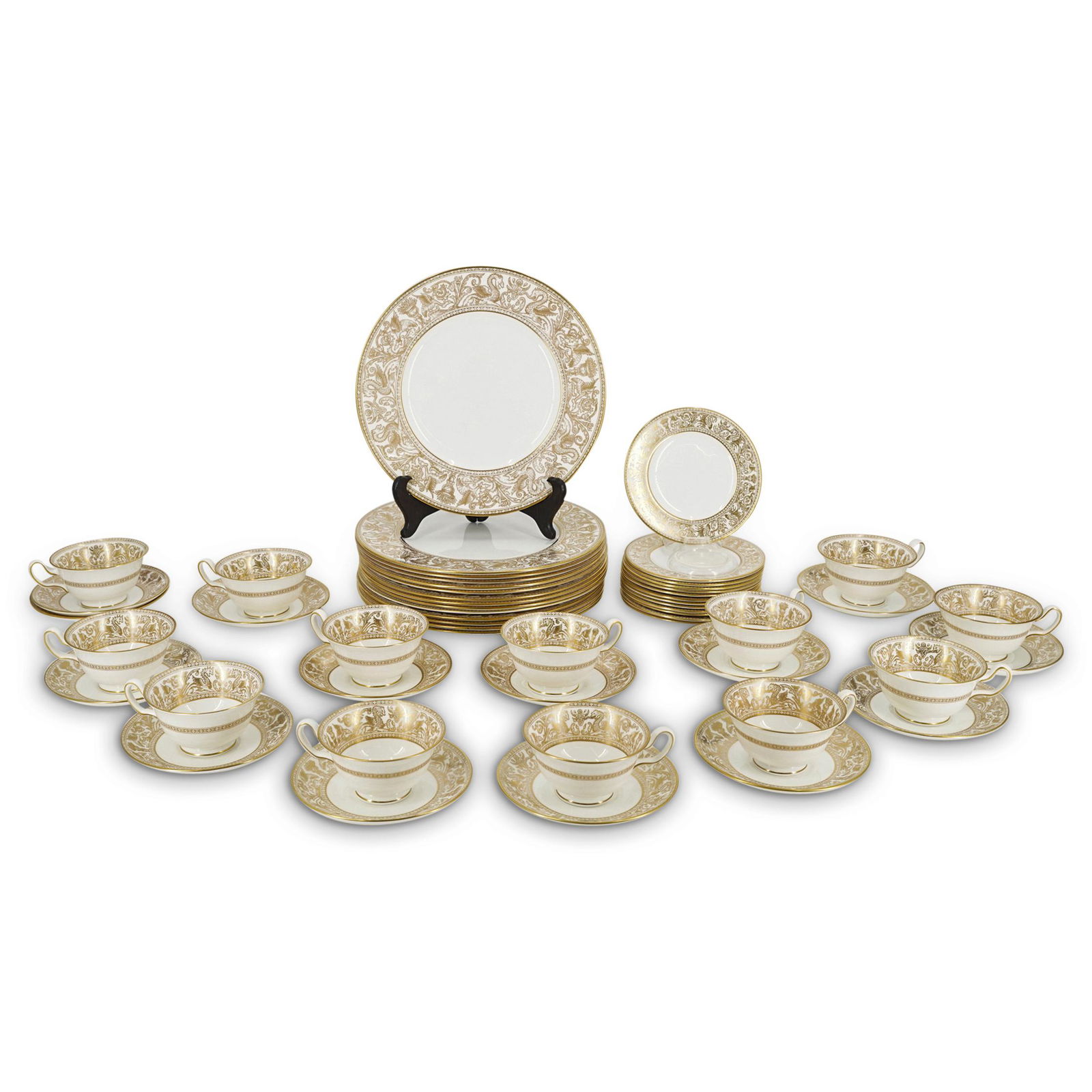 (54 Pc) Wedgwood Porcelain "Gold Florentine" Set: DESCRIPTION: (54 Pc) A Wedgwood porcelain dinnerware set in the "Gold Florentine" pattern depicting a decorated rim with gold dragons on a white background. Marked "Wedgwood" and "Bone China England G