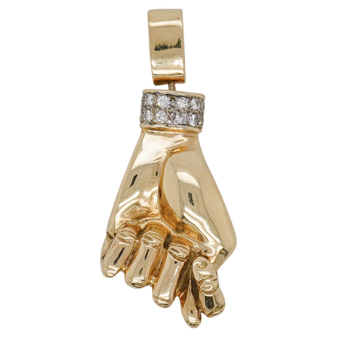 Italian 14k Gold and Diamond Figa Charm: DESCRIPTION: An Italian 14k yellow gold figa charm decorated along the wrist with Diamond embellished band, Stamped along the bale "14k". Total Weight: 11.7 dwt CIRCA: 20th Cent. ORIGIN: Italy DIMENSI