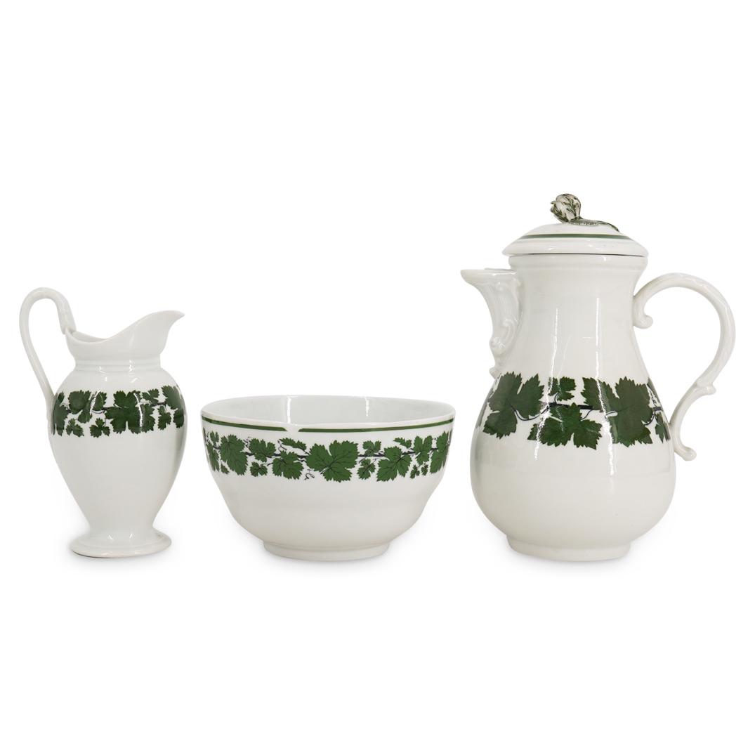 (3 Pc) Meissen Bowl And Pitchers: DESCRIPTION: Meissen bowl, open pitcher, and lidded pitcher, each decorated with a green-leaf vine motif. Pitchers are further embellished with curvilinear designs on the handle; lidded pitcher has si