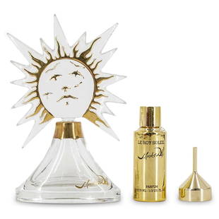 Salvador Dali "Le Roy Soleil" Baccarat Crystal Perfume: DESCRIPTION: A Salvador Dali "Le Roy Soleil" mouth-blown Baccarat Crystal perfume bottle with a hand painted 22 Karat gold stopper. This is a limited numbered edition, numbered 1020/97-3000. Marked