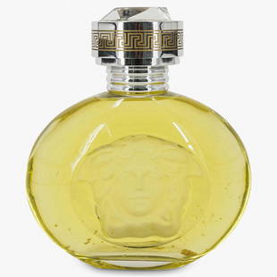 Large Display Versace Factice Dummy Perfume Bottle: DESCRIPTION: A vintage large display Versace Blonde factice dummy perfume bottle, with an embossed Medusa motif. (Ref. P18) CIRCA: 20th Century. DIMENSIONS: H: 11" W: 9 3/4". Have a similar item to se