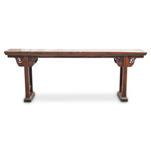 Antique Chinese Wood Altar Table: DESCRIPTION: An antique Chinese wood alter table with brown wood foundation, carved scrolling vine decorated skirting, finished on two open-work decorated legs. CIRCA: 19th Cent. ORIGIN: China DIMENSI