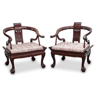 Pair of Chinese Horseshoe Chairs: DESCRIPTION: A pair of Chinese horseshoe chairs composed of brown wood with scrolling armrests, pierced back splat, and claw and ball feet. CIRCA: 20th Cent. ORIGIN: China DIMENSIONS: H: 30.25" x W: