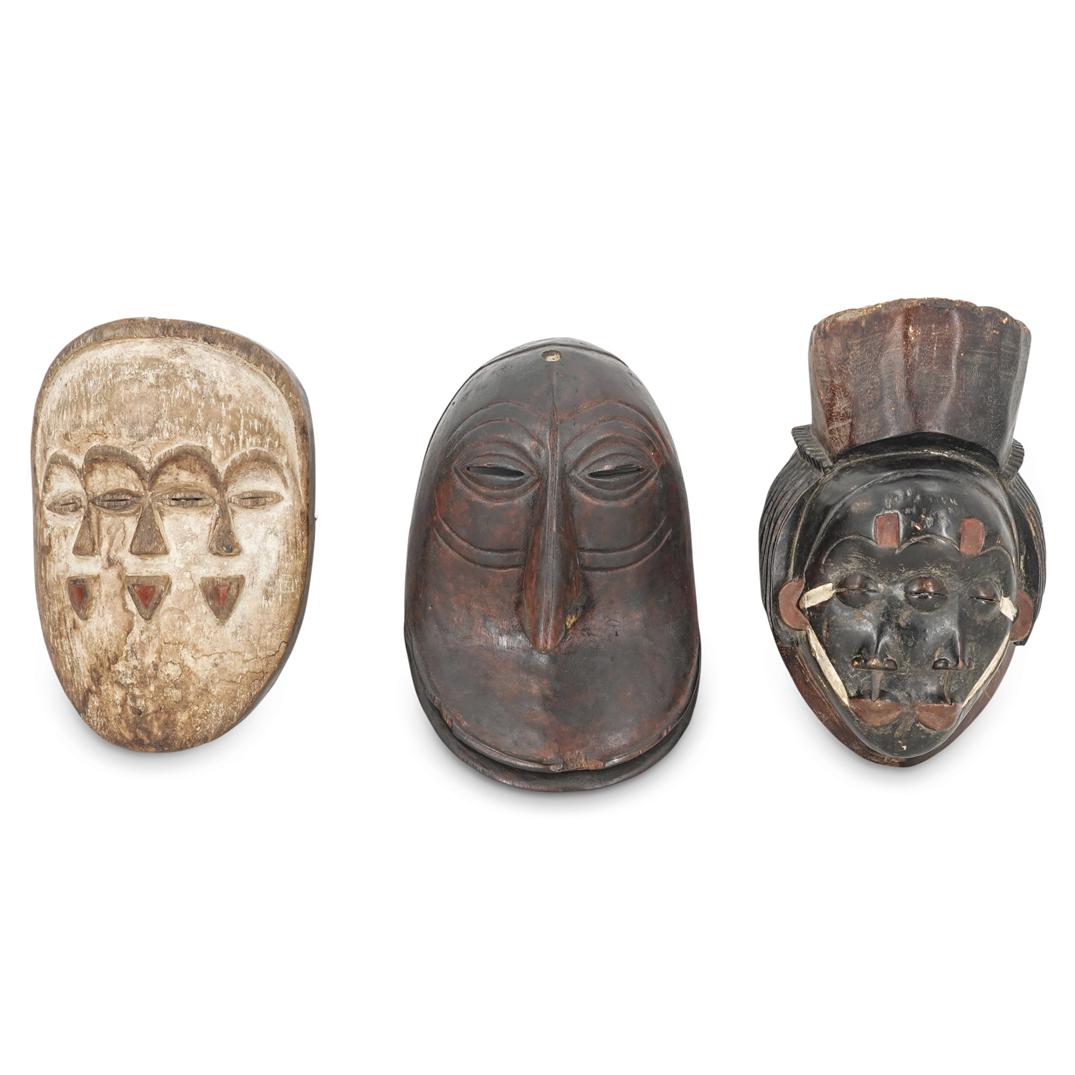 (3 Pc) African Mask Lot: DESCRIPTION: Three piece African mask lot including: one mask with three eyes, two mouths, and two noses, possibly a Punu mask; one Tsogo-style mask with four eyes, three noses, and three mouths; and