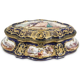 19th Century French Sevres Porcelain Box: DESCRIPTION: A 19th Century French Sevres Porcelain hinged box. This is a large oval shaped box, in cobalt blue ground color, painted with a central gallant scene, signed "V. Lebland", and decorated