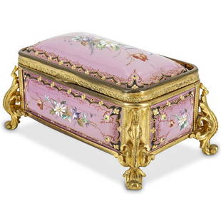 Fine French Bronze and Porcelain Dresser Box: DESCRIPTION: A French dresser box comprised of a porcelain body featuring in a pink ground, supported by gilt bronze frame with scrolling feet. The body decorated with fine hand painted floral motifs