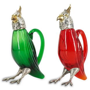 (2 Pc) Attrib. To Cartier Sterling Silver & Crystal Claret Jugs: DESCRIPTION: (2 Pc) Attrib. to Cartier pair of sterling silver and crystal claret jugs in red ruby and emerald green crystal colors. The attached detailed neck, head and feet are made of sterling