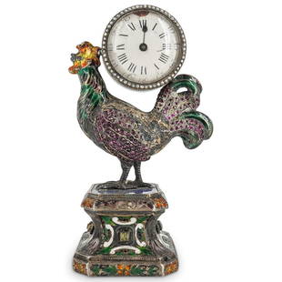 19th Cent. Viennese Silver Enamel & Jeweled Rooster Clock: DESCRIPTION: 19th Century Viennese silver and enamel desk clock, features a center mounted clock in a rooster formed case with inset crystal design. Finished on an ornate lapis lazuli inset plinth