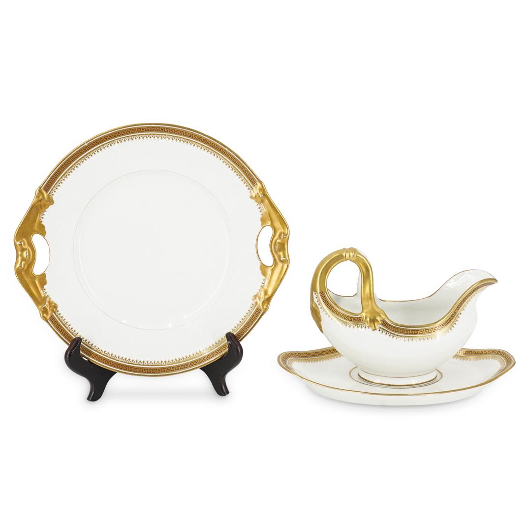 (3 Pc) L. Bernardaud Limoges Porcelain Grouping Set: DESCRIPTION: (3 Pc) A Leonard Bernardaud Limoges porcelain grouping set, in glazed white porcelain, with gold decorative rim with a red greek key pattern. This set includes: one (1) large gravy boat,