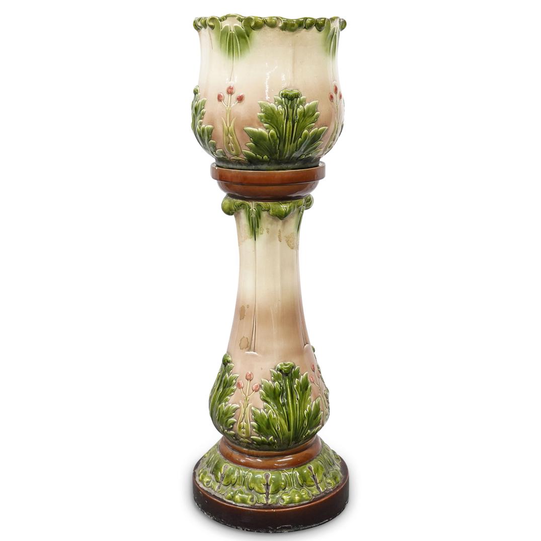 (2Pc) Sarreguemines French Majolica Jardiniere and Pedestal: DESCRIPTION: French Sarreguemines majolica jardiniere and pedestal with coffee colored base, relief leaves molding and peach toned column. Jardiniere continues the theme with relief leaves and flowers