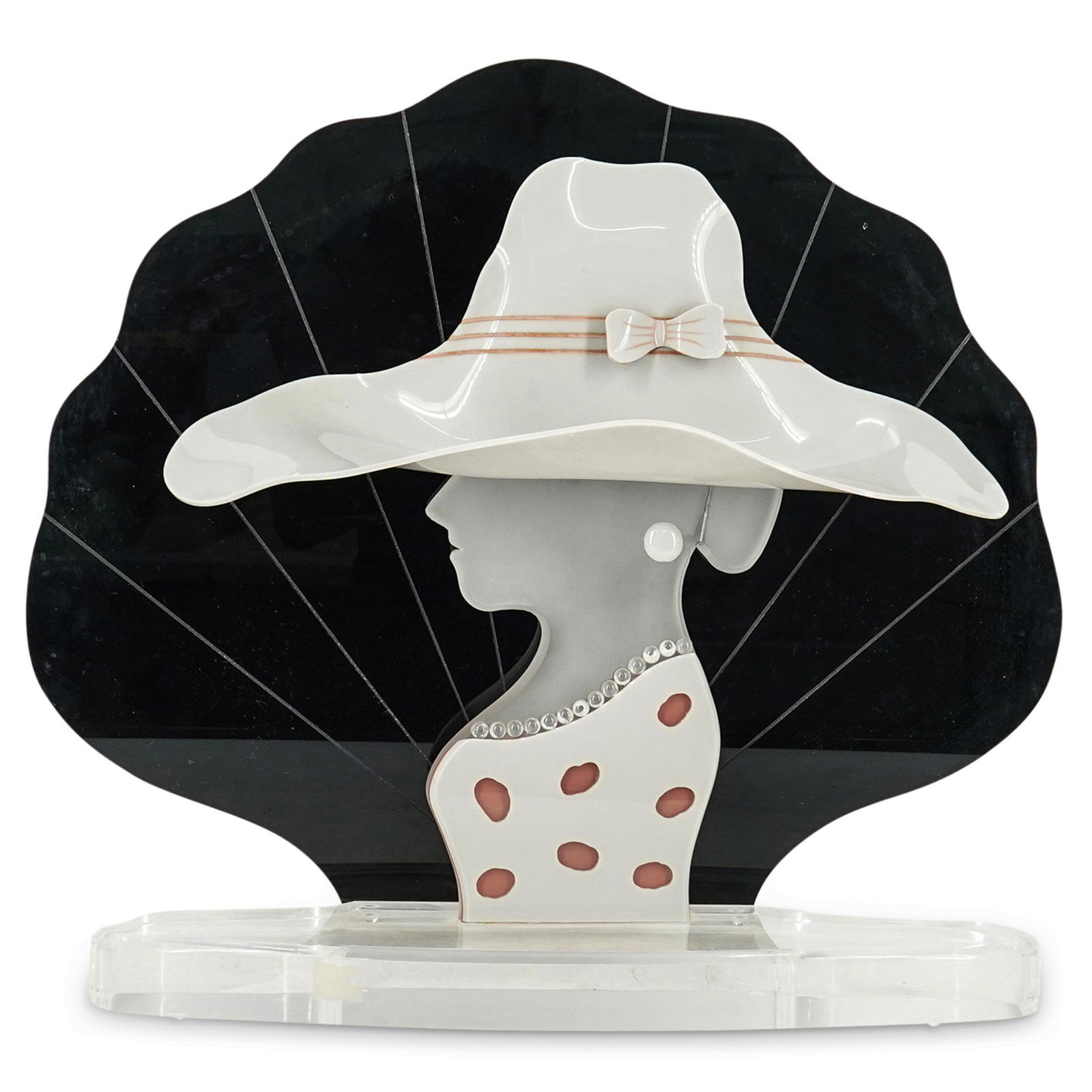 Lucite Fashion Themed Female Silhouette: DESCRIPTION: Display piece of a fashionable woman in a spotted dress and sun hat with a bow and seashell backdrop composed of lucite. CIRCA: Mid 20th Cent. ORIGIN: USA DIMENSIONS: H: 19.5" X W: 19.25"