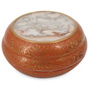 Chinese Qianlong Faux Marble Porcelain Lidded Box: DESCRIPTION: Porcelain lidded circular box decorated with a faux marble inset on the lid ringed with a gilt border, gilt floral designs against a coral tone background, and a red Qianlong mark on