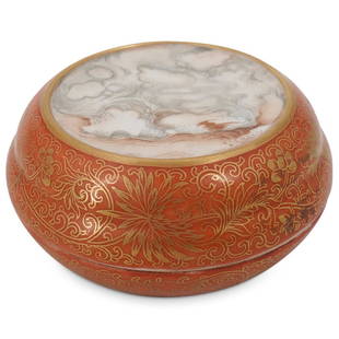 Chinese Qianlong Faux Marble Porcelain Lidded Box: DESCRIPTION: Porcelain lidded circular box decorated with a faux marble inset on the lid ringed with a gilt border, gilt floral designs against a coral tone background, and a red Qianlong mark on