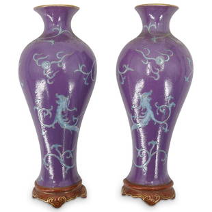 Pair Of Ex Christie's Qianlong Era Porcelain Wall Vases: DESCRIPTION: Two matching Qianlong era shouldered wall vases, each decorated with a foliage-form dragon pursuing a flaming pearl. Each piece has gilt accents on the lip and foot and blue glaze